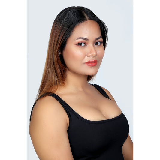 a woman in a black top posing for a picture